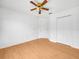 Bright, airy bedroom with hardwood floors, ceiling fan, and ample space for relaxation at 8350 Split Creek Cir, Lakeland, FL 33809