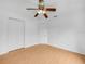 Comfortable bedroom with ceiling fan and double door closet, offering ample storage at 8350 Split Creek Cir, Lakeland, FL 33809