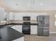 Modern kitchen featuring stainless steel appliances, sleek countertops and ample cabinet space at 8350 Split Creek Cir, Lakeland, FL 33809