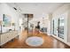 Foyer with hardwood floors, a spiral staircase, and views of the dining and kitchen areas at 949 Success Ave, Lakeland, FL 33801