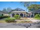 Charming single-Gathering home featuring an arched porch, port cochere and meticulous landscaping at 949 Success Ave, Lakeland, FL 33801