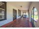 Covered front porch with brick flooring and classic architecture at 949 Success Ave, Lakeland, FL 33801