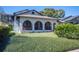 Attractive single-Gathering home featuring a lovely lawn and three prominent arched windows at 949 Success Ave, Lakeland, FL 33801