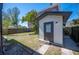 Exterior view of detached garage, surrounded by a well maintained yard at 949 Success Ave, Lakeland, FL 33801