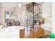 Kitchen featuring custom cabinets, black and white checkered floor, spiral staircase, and hardwood floors at 949 Success Ave, Lakeland, FL 33801