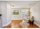 Bright living room with hardwood floors, light walls, and window with natural light at 949 Success Ave, Lakeland, FL 33801