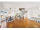 Open concept area with spiral stairs, dining table and a partial view of the kitchen at 949 Success Ave, Lakeland, FL 33801