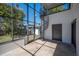 Spacious sunroom featuring a spiral staircase, brick floors and great natural light at 949 Success Ave, Lakeland, FL 33801