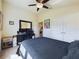 Comfortable bedroom featuring plush carpeting and a workspace at 1134 Legatto Loop, Dundee, FL 33838