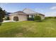 Charming single-story home featuring a well-manicured lawn and inviting curb appeal at 1134 Legatto Loop, Dundee, FL 33838