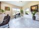 Bright sitting area with tile floors, vaulted ceilings, two windows for natural light, and stylish decor at 1134 Legatto Loop, Dundee, FL 33838