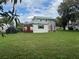 Expansive backyard displaying lush greenery and diverse vegetation, promising a serene outdoor experience at 117 Tremont Dr, Winter Haven, FL 33884
