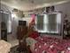 Bedroom featuring playful decor, a TV, and a window with blinds at 117 Tremont Dr, Winter Haven, FL 33884