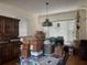 Dining area with hardwood floors, a decorative light fixture, and a large window at 117 Tremont Dr, Winter Haven, FL 33884