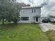 Traditional two-story home with a well-maintained lawn and driveway, offering classic charm and curb appeal at 117 Tremont Dr, Winter Haven, FL 33884