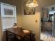 Eat-in kitchen with wooden dining table and a view into the updated kitchen area at 117 Tremont Dr, Winter Haven, FL 33884