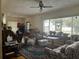 Bright living room with large windows, hardwood floors, and vintage details at 117 Tremont Dr, Winter Haven, FL 33884