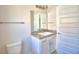 Bathroom featuring a tile shower, mirror, and vanity sink at 136 Krenson Bay Loop, Winter Haven, FL 33881
