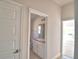 Elegant bathroom showing vanity and sink, with door entries to other rooms at 136 Krenson Bay Loop, Winter Haven, FL 33881