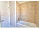 Bathroom with tile shower and soaking tub at 136 Krenson Bay Loop, Winter Haven, FL 33881