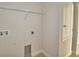 Practical laundry room with hookups and shelving for efficient organization at 136 Krenson Bay Loop, Winter Haven, FL 33881