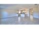 Inviting open floor plan with tiled floors, a modern kitchen, and abundant natural light at 136 Krenson Bay Loop, Winter Haven, FL 33881