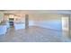 Bright, open floor plan featuring a modern kitchen, tile floors, and ample living space at 136 Krenson Bay Loop, Winter Haven, FL 33881