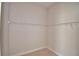 Well-organized walk-in closet features ample wire shelving for storage at 136 Krenson Bay Loop, Winter Haven, FL 33881