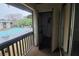 Balcony overlooking pool with open storage area and ample natural light and view at 141 Fernery Rd # B5, Lakeland, FL 33809