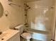 Bright bathroom featuring a shower-tub combination, toilet, and a well-lit vanity area at 141 Fernery Rd # B5, Lakeland, FL 33809