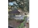 Community building with ample windows, fenced patio, and lush landscaping at 141 Fernery Rd # B5, Lakeland, FL 33809