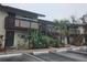 Apartment building exterior with stairs, balconies, and mature tropical landscaping at 141 Fernery Rd # B5, Lakeland, FL 33809