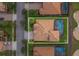 Aerial view of the property showcasing the pool and the golf course behind the house at 1420 Mickelson Ct, Davenport, FL 33896