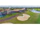 Aerial view of properties overlooking the golf course and lake views at 1420 Mickelson Ct, Davenport, FL 33896
