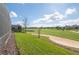 Gorgeous backyard view overlooking a golf course, sand trap, and pond from the home at 1420 Mickelson Ct, Davenport, FL 33896