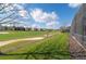 Beautiful backyard view overlooking the golf course with sand traps and manicured lawns at 1420 Mickelson Ct, Davenport, FL 33896