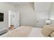 Bright bedroom features a comfortable bed with starfish patterned blanket and a neutral decor at 1420 Mickelson Ct, Davenport, FL 33896