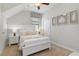 Bright bedroom featuring a white bed frame, white walls, and carpeted floors at 1420 Mickelson Ct, Davenport, FL 33896