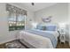 Cozy bedroom featuring a king-sized bed, a ceiling fan, and a window with wood-slat blinds at 1420 Mickelson Ct, Davenport, FL 33896