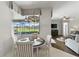 Cozy breakfast nook overlooking the lanai and pool area, with a view into the living area at 1420 Mickelson Ct, Davenport, FL 33896