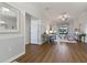 Well-lit living room showcasing hardwood floors, a ceiling fan, and neutral wall tones at 1420 Mickelson Ct, Davenport, FL 33896