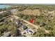Aerial view of homes along a road, showing their layout within a community and their relation to each other at 151 3Rd Ave, Babson Park, FL 33827