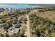 The property features an aerial view of a lakeside home, showcasing its water access and scenic location at 151 3Rd Ave, Babson Park, FL 33827