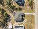 Overhead view of house featuring roof and surrounding yard space with nearby house with solar panels at 151 3Rd Ave, Babson Park, FL 33827