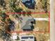 Aerial view of the property showcasing the home's layout, yard, and surrounding area at 151 3Rd Ave, Babson Park, FL 33827