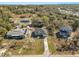 Aerial view of a charming home, with a long driveway and well-maintained lawn at 151 3Rd Ave, Babson Park, FL 33827