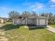 Charming single-story home with a well-maintained lawn and attached one car garage at 151 3Rd Ave, Babson Park, FL 33827