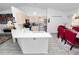 Bright kitchen with stainless steel appliances, modern countertops, and an adjacent dining space at 151 3Rd Ave, Babson Park, FL 33827