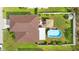 Aerial view of a home with a private backyard featuring a pool, gazebo, shed and fenced yard at 1526 Country Chase St, Lakeland, FL 33810