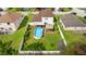 Aerial view of a home with a private backyard featuring a pool, gazebo, shed and fenced yard at 1526 Country Chase St, Lakeland, FL 33810